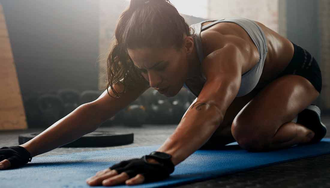 TruSelf Sporting Club woman stretching gym image